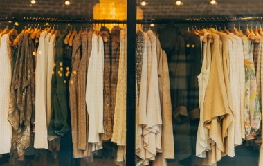 clothes hanging in a boutique window