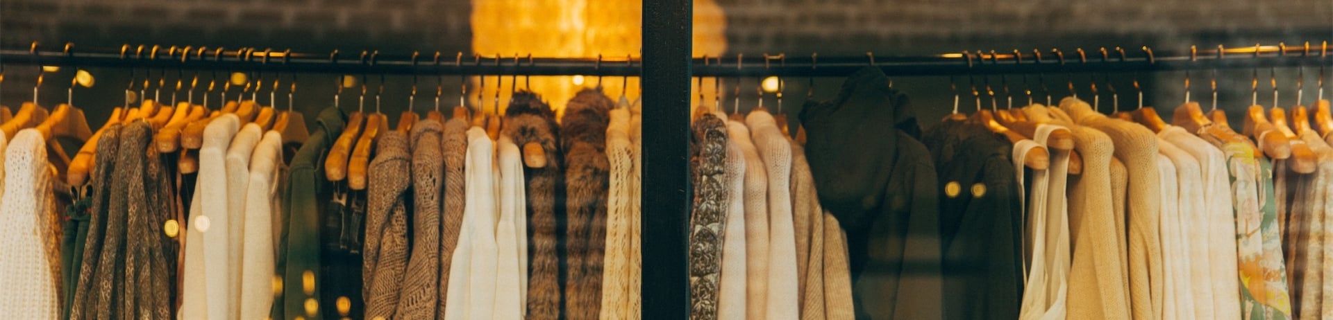 clothes hanging in a boutique window