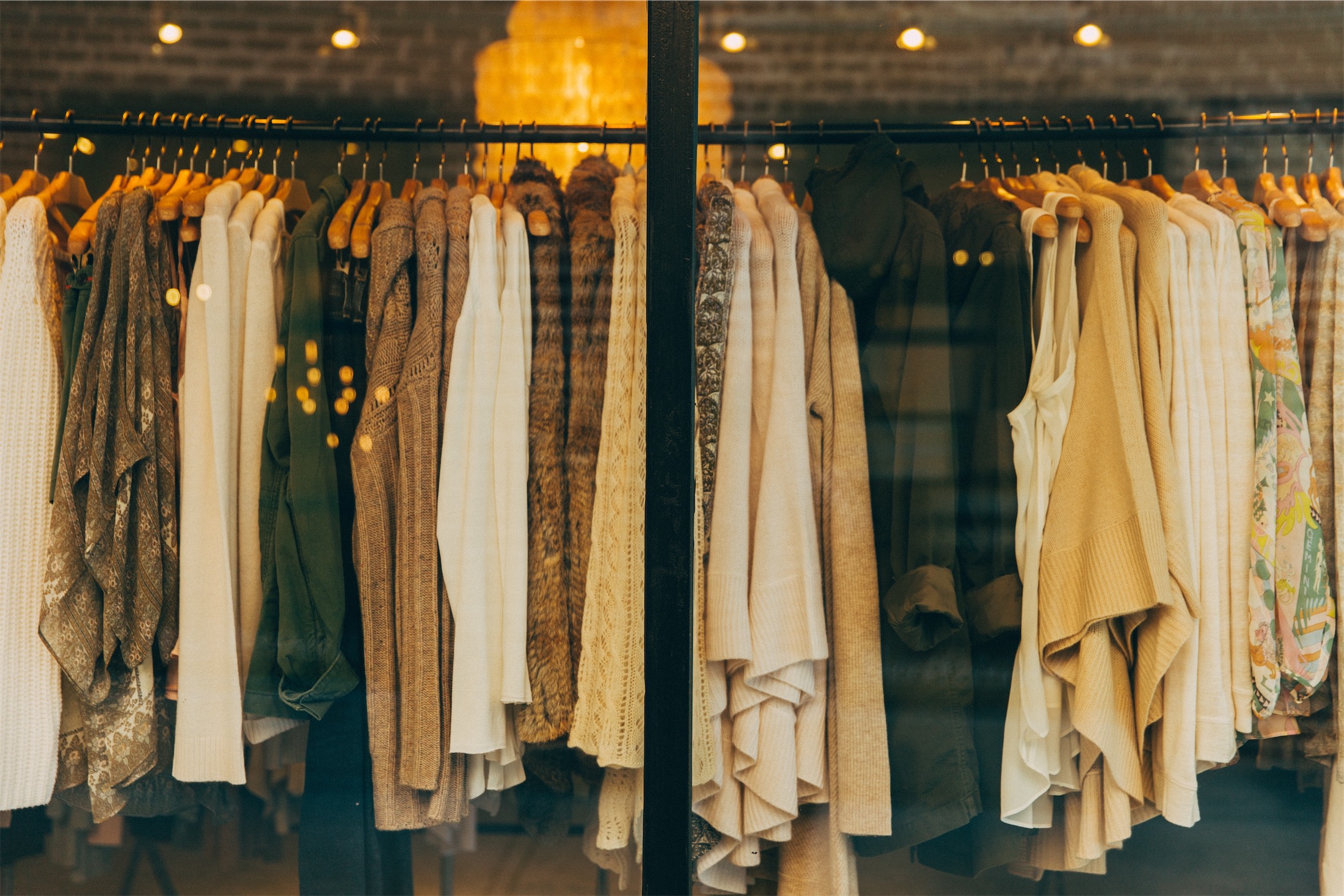 clothes hanging in a boutique window