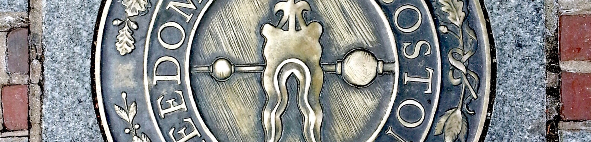 the freedom trail emblem on the ground