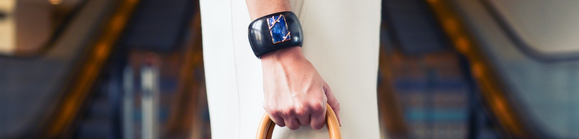 woman holding a louis vitton bag