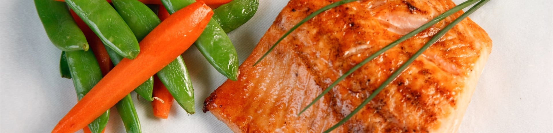 close up of salmon and veggies