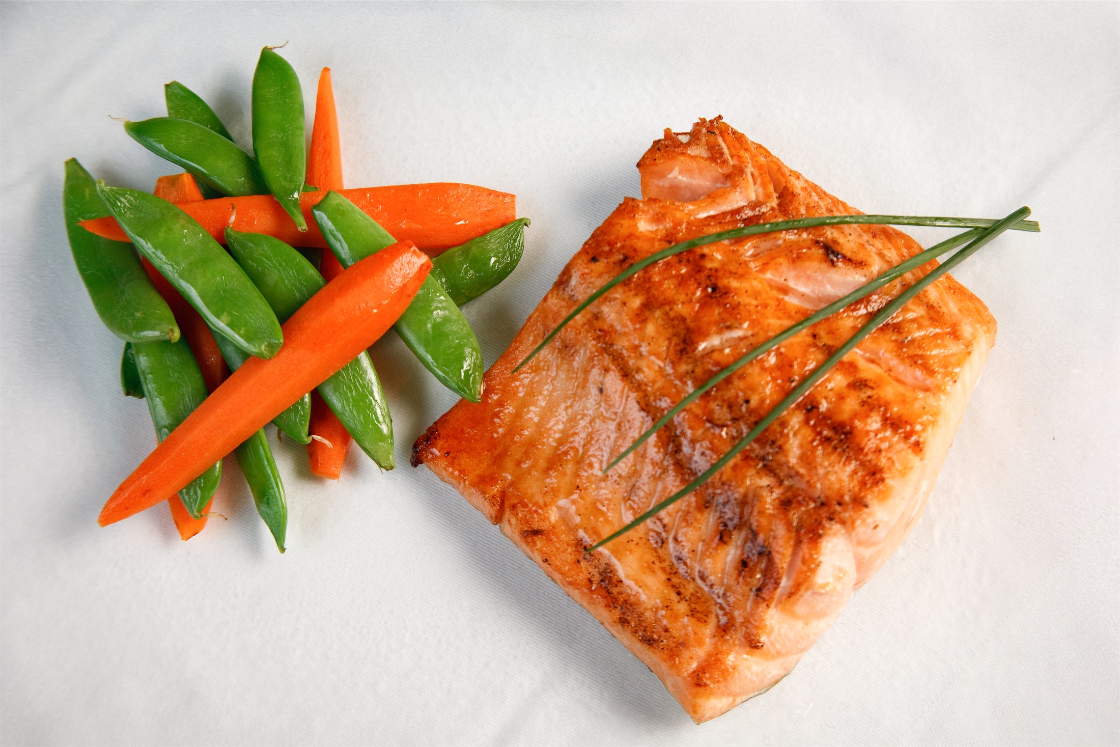close up of salmon and veggies