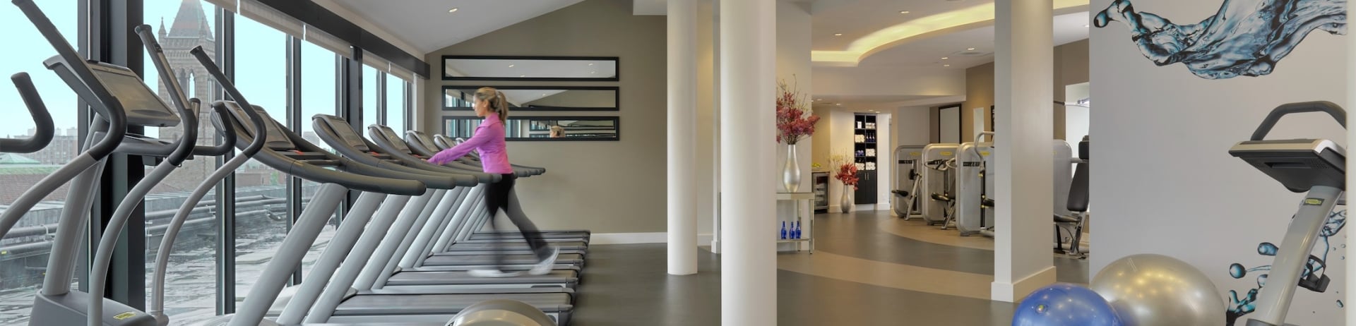 woman walking on a treadmill in the gym
