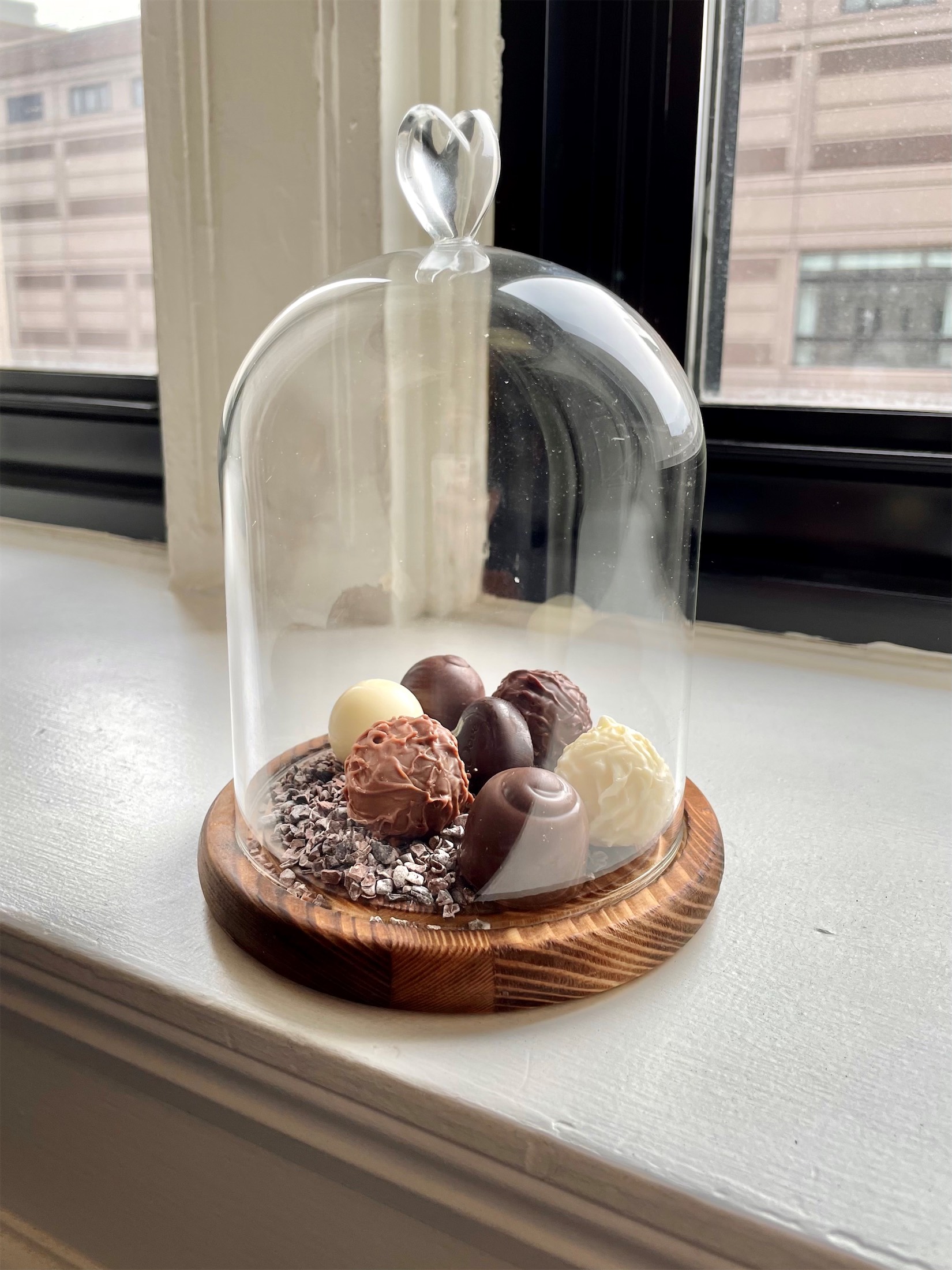 artisanal chocolate under a glass dome