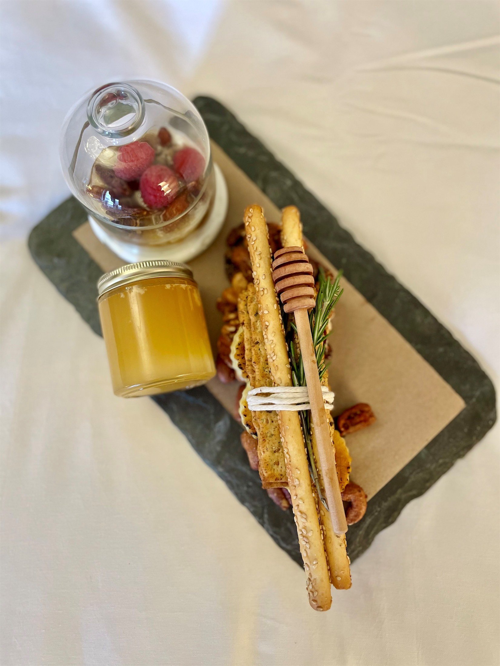 bread sticks and fruit on a tray
