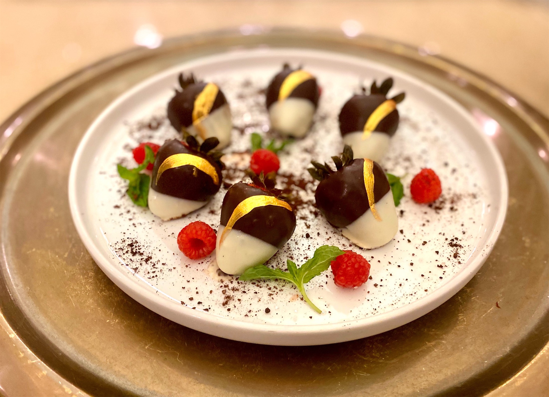 chocolate cover strawberries on a white plate