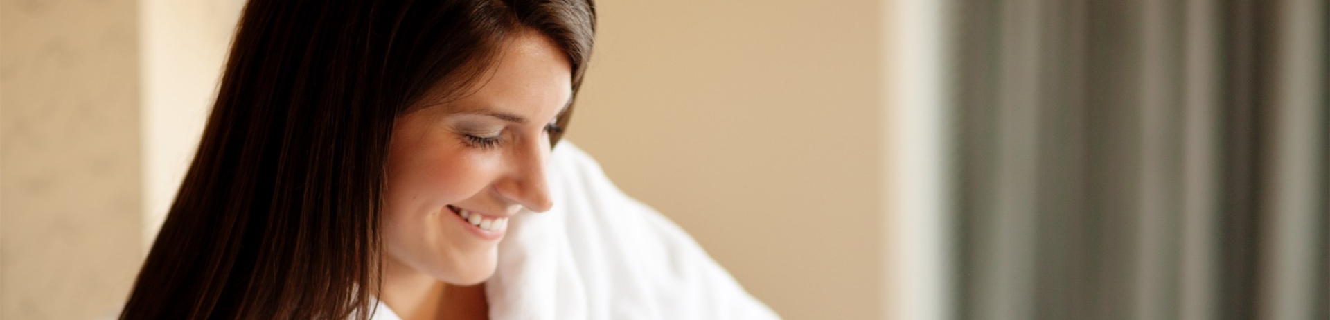 woman drinking coffee in bed