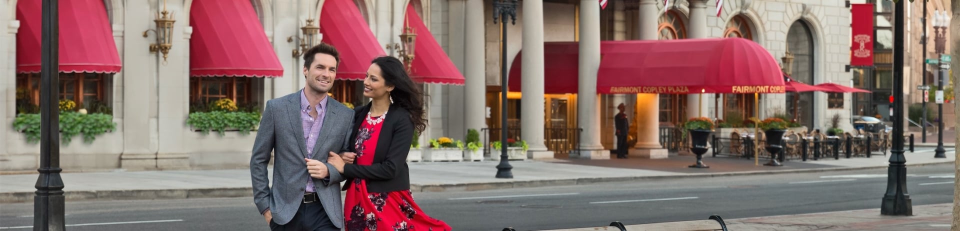 couple walking away from copley plaza