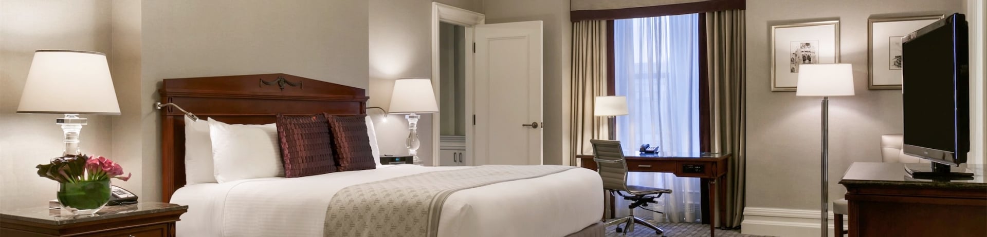 bedroom with desk in front of the window