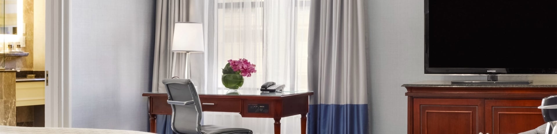 bedroom with a desk and small coffee area