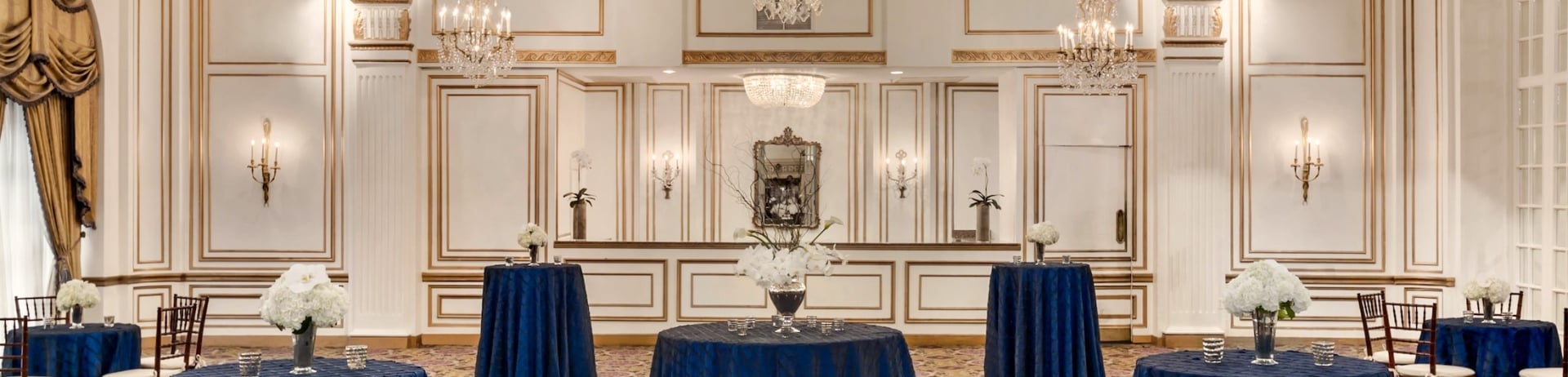large meeting room set up with round tables