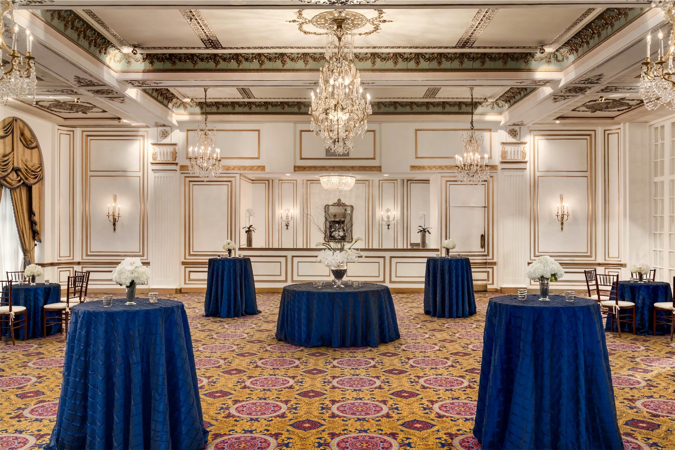 large meeting room set up with round tables