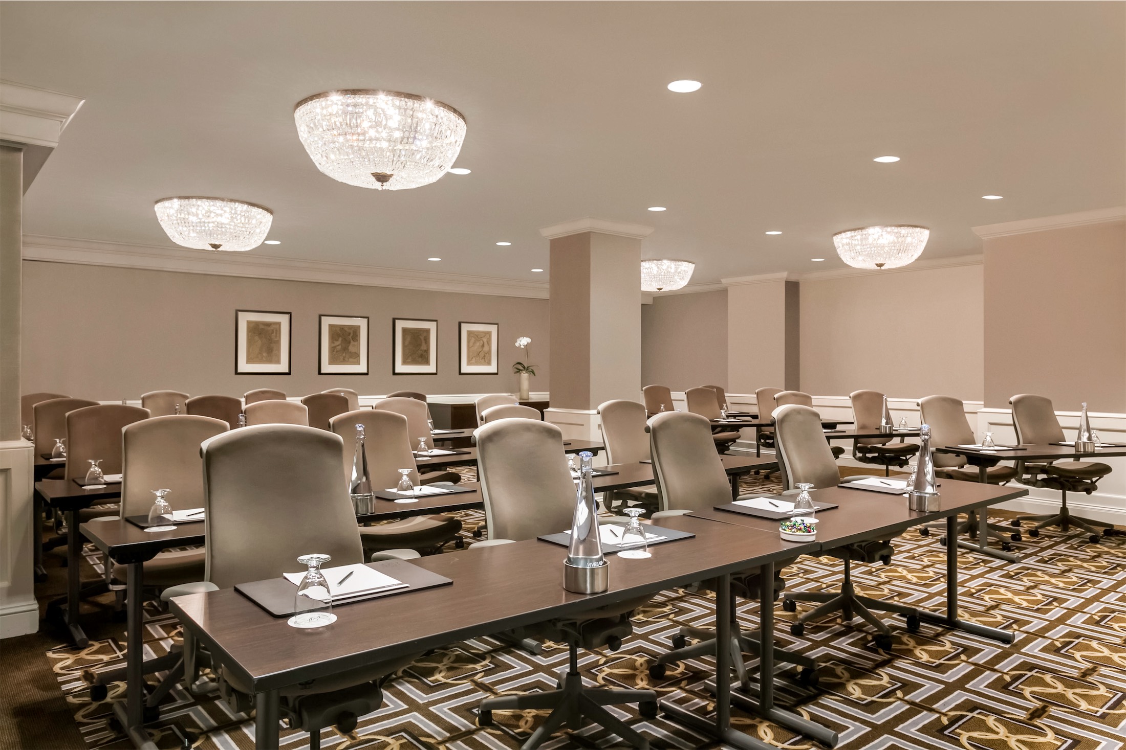 meeting room set up with rows of tables