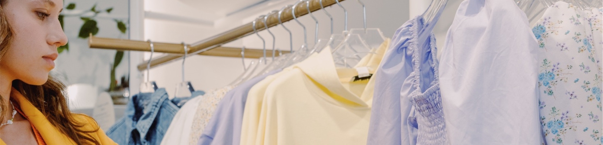woman in a yellow coat shopping